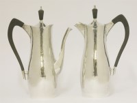 Lot 204 - A pair of silver café au lait pots