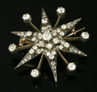 Lot 344 - A cased Victorian diamond set star brooch/pendant