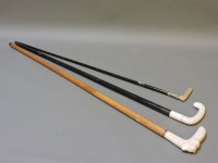 Lot 262 - Three Victorian ivory and mother of pearl walking sticks