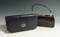 Lot 425 - A Gucci vintage navy leather clutch bag