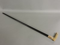 Lot 223 - A horn and rolled gold mounted walking stick