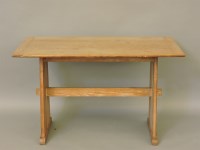 Lot 563 - An early 20th century Heals style limed oak dining table