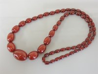 Lot 71 - A single row graduated olive shaped bakelite bead necklace