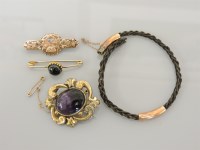 Lot 10 - A Victorian cabochon amethyst brooch