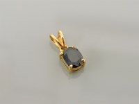 Lot 13 - A single stone oval cut sapphire pendant