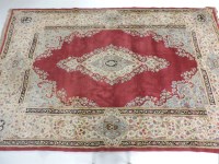 Lot 421 - A large puce ground rug