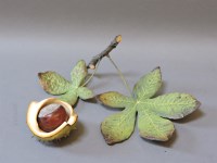 Lot 156 - ##A modern cold painted bronze chestnut on a branch