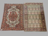 Lot 475 - A small cream ground Persian carpet