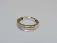 Lot 42 - A white gold three row princess cut diamond half hoop ring