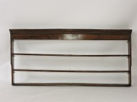 Lot 579 - ##A George III elm plate rack