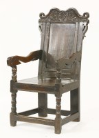 Lot 336 - An oak armchair