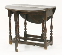 Lot 347 - An oak gateleg table