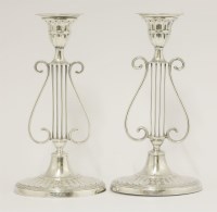 Lot 156 - A pair of Edwardian silver candlesticks