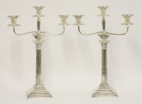 Lot 175 - A matched pair of Victorian silver Corinthian column three-light candelabra