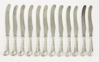 Lot 70 - A set of twelve 18th century silver scroll pistol-handled table knives