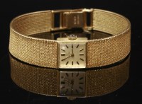 Lot 619 - A ladies' 9ct gold Omega mechanical bracelet watch