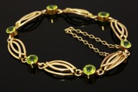 Lot 383 - An Edwardian six stone peridot bracelet