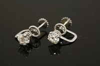 Lot 411 - A pair of white gold single stone diamond earrings