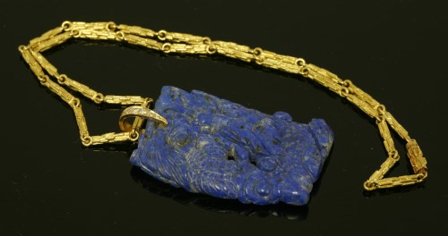 Lot 479 - A cased lapis lazuli and diamond pendant by Andrew Grima
