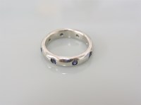 Lot 19A - A platinum court shaped band ring