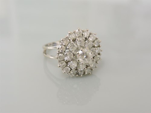 Lot 23 - A white gold three tier diamond cluster ring