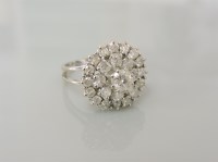 Lot 23A - A white gold three tier diamond cluster ring