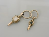 Lot 8 - Two gold cased watch keys