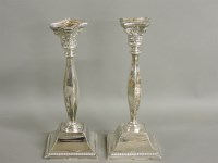 Lot 143 - A pair of silver candlesticks