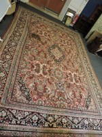 Lot 357 - A large Persian rug