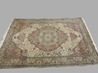 Lot 502 - A cream ground Persian carpet