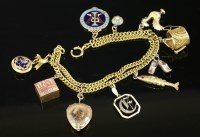 Lot 294 - An 18ct gold two row curb chain charm bracelet