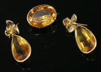 Lot 469 - A gold citrine set brooch and earring matched suite