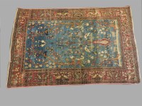 Lot 589 - An antique Persian carpet