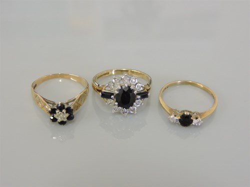 Lot 13 - A 9ct gold sapphire and diamond cluster ring