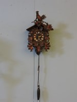 Lot 361 - A Bavarian carved soft wood wall mounted cuckoo clock