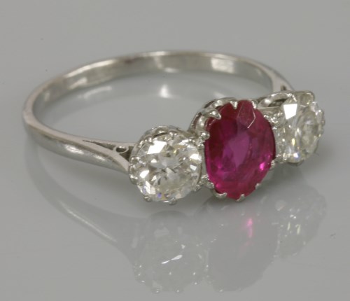 Lot 7 - A three stone synthetic ruby and diamond ring