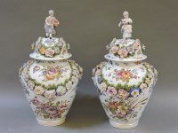 Lot 414 - A pair of 19th century Continental lidded urns