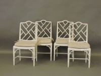 Lot 733 - A set of four white lattice back chairs