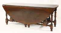 Lot 601 - A large oak gateleg table