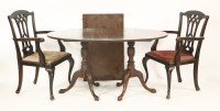 Lot 610 - A George III style mahogany twin pillar dining table