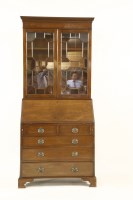 Lot 630 - A Georgian style mahogany bureau bookcase