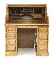 Lot 658 - An early 20th century American oak 'S' tambour roll top desk