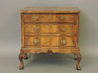 Lot 544 - A walnut chest of three long drawers