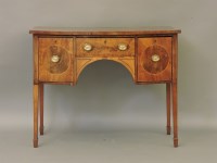 Lot 605 - A George III strung mahogany bow front sideboard