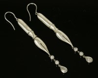 Lot 22 - A pair of sterling silver diamond set drop earrings in the form of fountain pen nibs