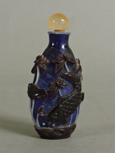 Lot 60 - A Chinese overlaid glass scent bottle and stopper