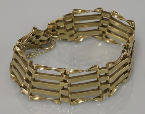Lot 11 - A 9ct gold five straight and twisted bar gate bracelet