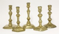 Lot 421 - Five brass candlesticks