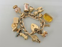 Lot 21 - A 9ct gold charm bracelet