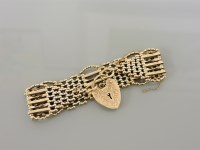 Lot 6 - A 9ct gold seven row gate link bracelet